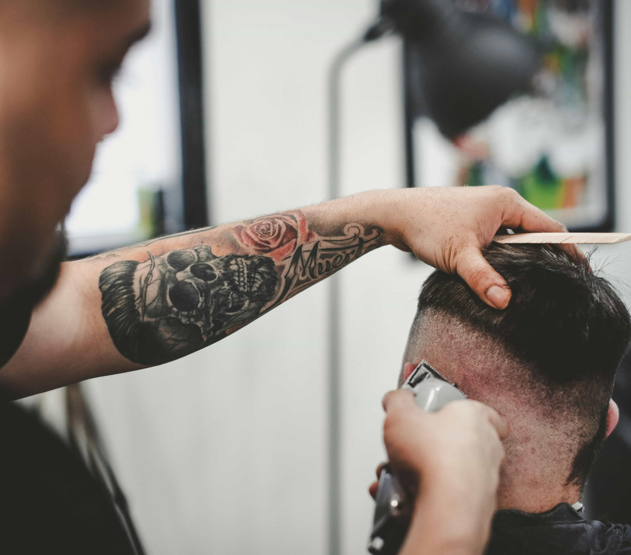 Photo: John Arano on Unsplash Image of a barber at work